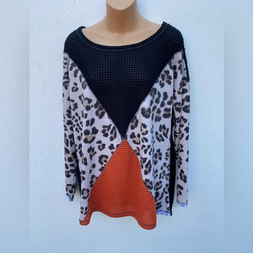 Long sleeve cheetah black and orange boutique shirt. NWT